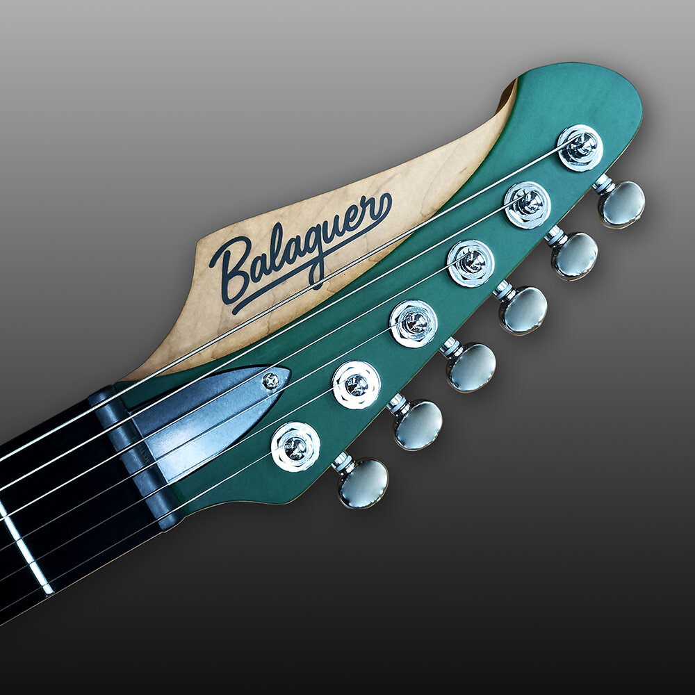 the_toro_aw_see-thru_turquois_headstock.jpg